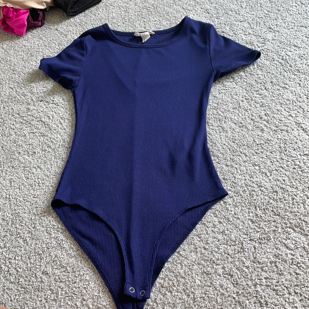 dark blue bodysuit barley worn